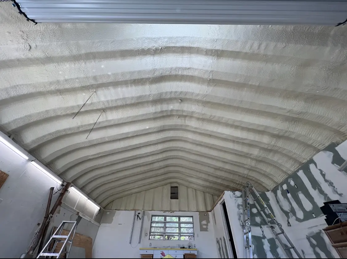 Spray polyurethane foam applied to the underside of a metal roof deck in Oakmont